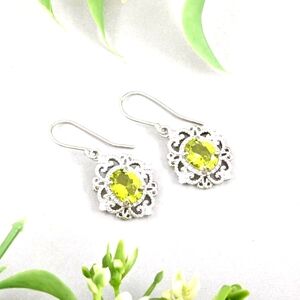 Elegant Simulated Diamond And Peridot Earrings In Silvertone